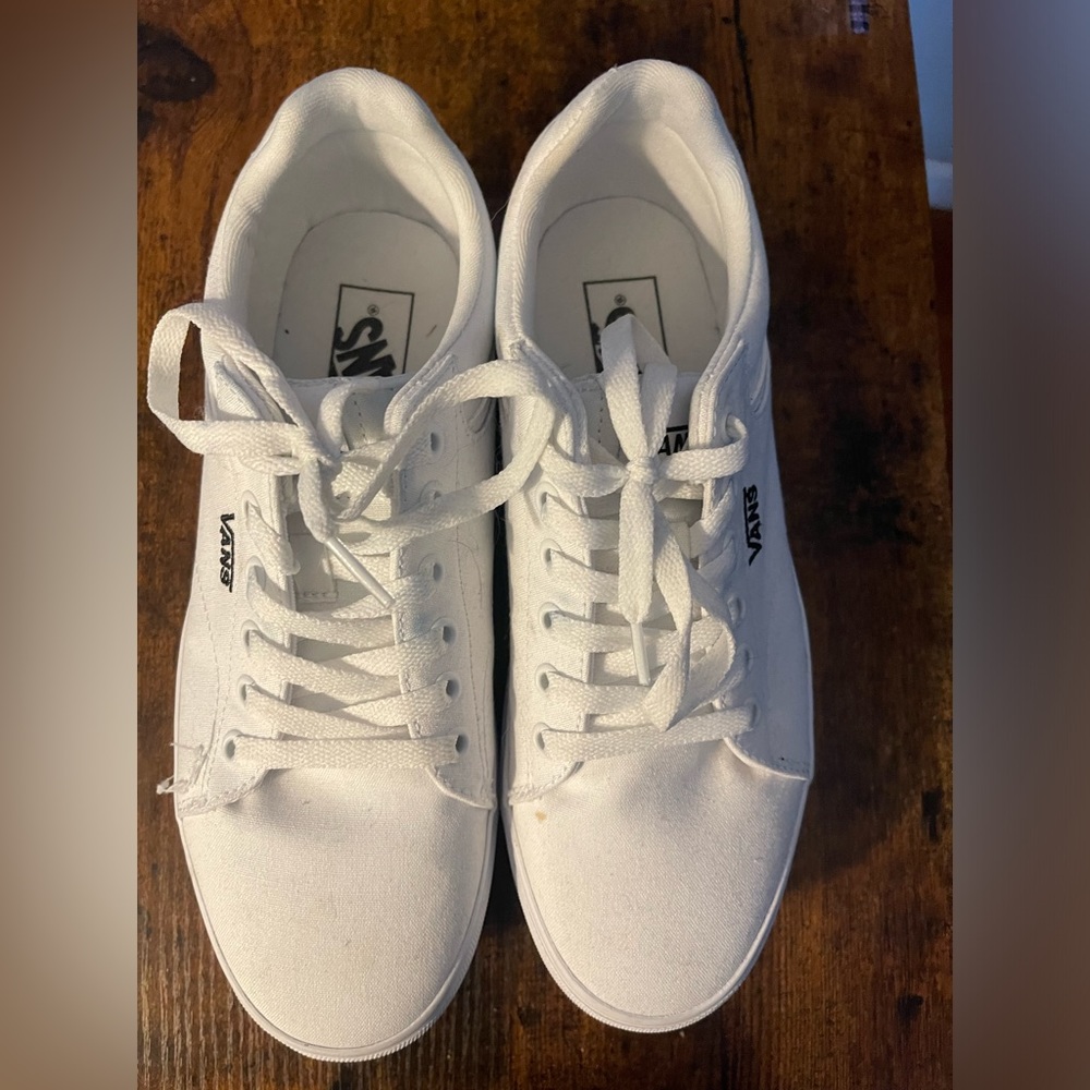 Women’s Vans size 8.5 white canvas sneakers.  Brand new. Never worn
